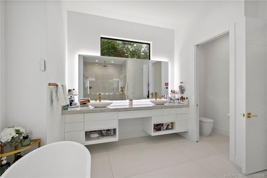 Experience modern waterfront luxury in this stunning - photo 25