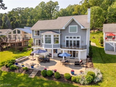 Live the lakefront dream at this exceptional 4-bedroom, 5.5-bath - Lake Home For Sale in Malvern, Ohio