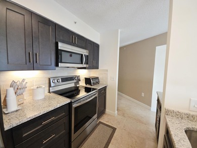 Exquisitely renovated corner residence offering 1,129 sq ft of