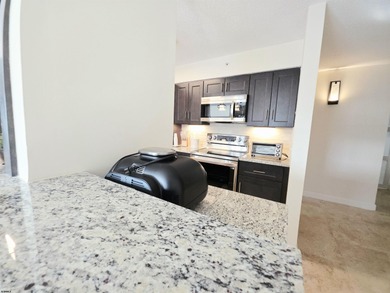 Exquisitely renovated corner residence offering 1,129 sq ft of