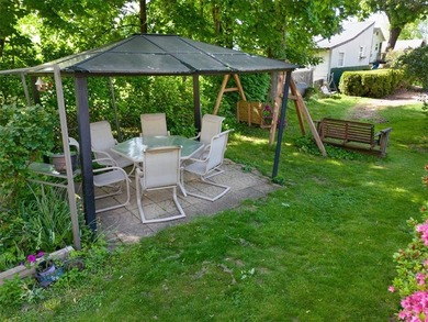 Welcome to this charming lakeside retreat tucked away on a - photo 41