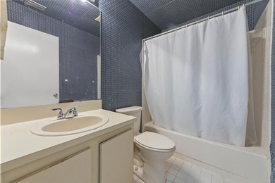 Welcome to this charming two-bedroom, two-bathroom condominium - photo 17
