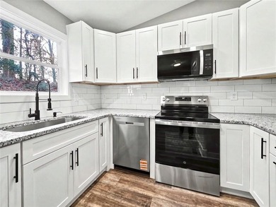This beautifully updated split-level home offers 3 bedrooms and - photo 12