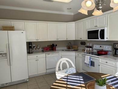 NO STAIRS in this one level, ground floor, end-unit condo