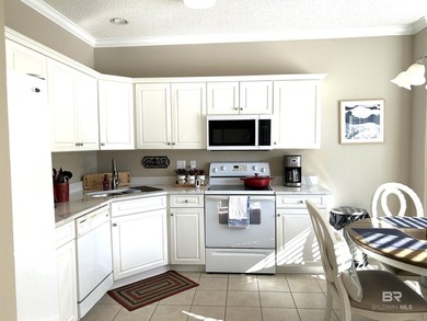 NO STAIRS in this one level, ground floor, end-unit condo