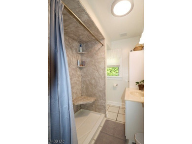 Charming custom-built Cape Cod home nestled on a prime corner - photo 10