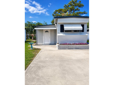 Located in a quiet 55+ community, this well-maintained home - photo 1