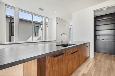 Discover an exquisite three-story modern home in Northern Hills