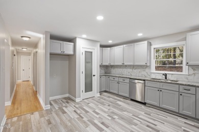 This beautifully remodeled ranch home sits within the