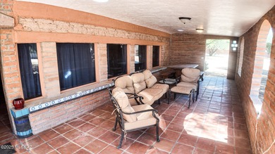 This unique property has distinct Old West Charm! Three houses