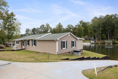 RIGHT ON THE WATER! Literally just a few steps to the water on - Lake Home For Sale in Cross Hill, South Carolina