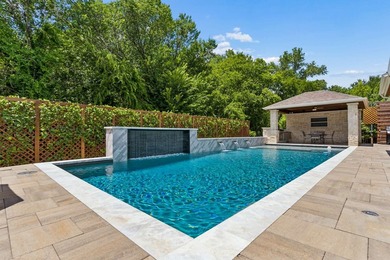 Over $600,000 in renovations have transformed this exceptional - photo 2