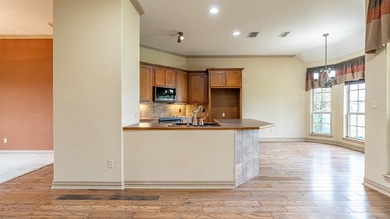 Beautifully maintained brick home with cut stone accents. Easy - photo 8