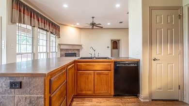 Beautifully maintained brick home with cut stone accents. Easy - photo 9