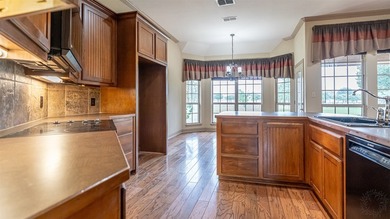 Beautifully maintained brick home with cut stone accents. Easy - photo 10