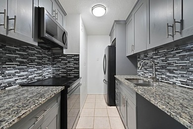 Welcome to this inviting second-floor condo in West Palm Beach - photo 1