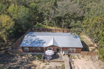 Cute home tucked away near Cedar Creek Lake - Lake Home For Sale in Mabank, Texas