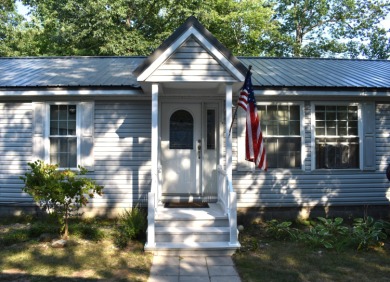 Lake Home For Sale in Topinabee, Michigan