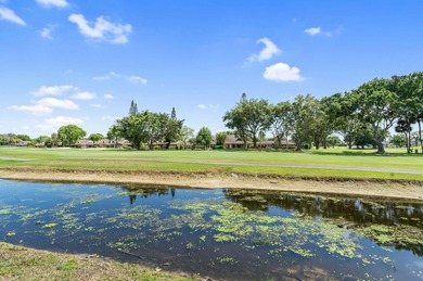 Wake up to tranquil lake and golf course views in this - photo 17