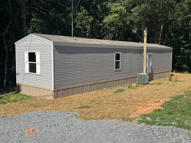 This BRAND NEW 2-bedroom 2-bathroom mobile home offers comfort - photo 1