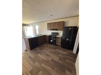 This BRAND NEW 2-bedroom 2-bathroom mobile home offers comfort - photo 3