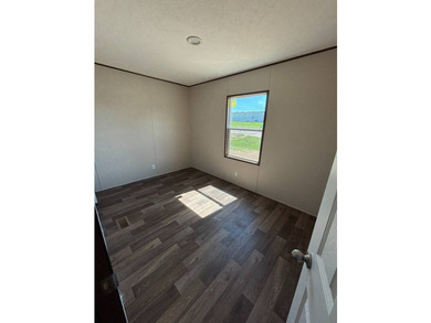 This BRAND NEW 2-bedroom 2-bathroom mobile home offers comfort - photo 4