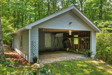 Charming cottage home nestled on nearly 7 private wooded acres - photo 6