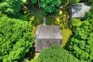 Charming cottage home nestled on nearly 7 private wooded acres - photo 10