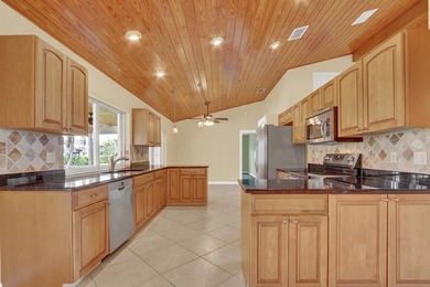 Welcome to Tequesta Country Club, where golf course living meets - photo 14