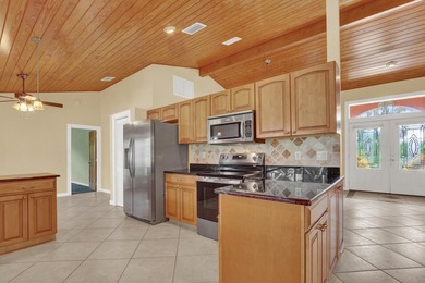 Welcome to Tequesta Country Club, where golf course living meets - photo 15