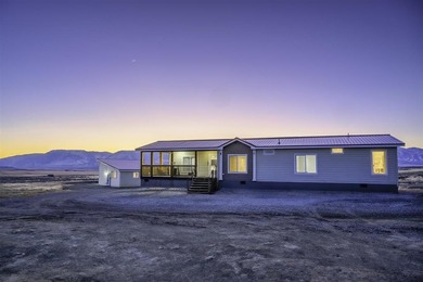 Set on 35.5 acres, this property features two modern homes, a