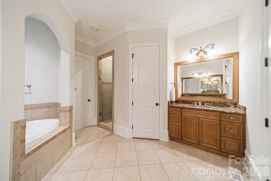 Located in the exclusive gated community of Chatelaine, this - photo 12