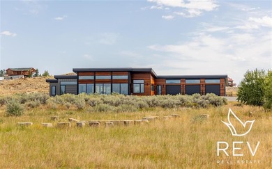 This modern rural retreat is 5 minutes east of downtown Cody, on