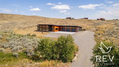 This modern rural retreat is 5 minutes east of downtown Cody, on