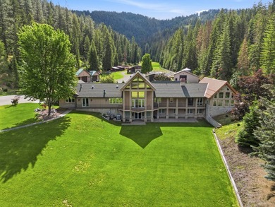 Perched behind a grand gated entrance and winding tree-lined - photo 1