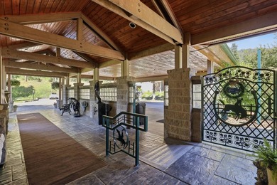 Perched behind a grand gated entrance and winding tree-lined - photo 6