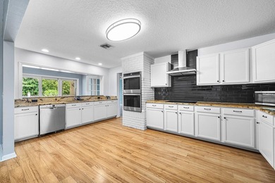 Set on a beautifully manicured and fenced 1.15-acre lot, this - photo 18