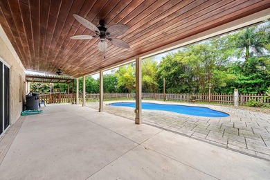 Set on a beautifully manicured and fenced 1.15-acre lot, this - photo 32