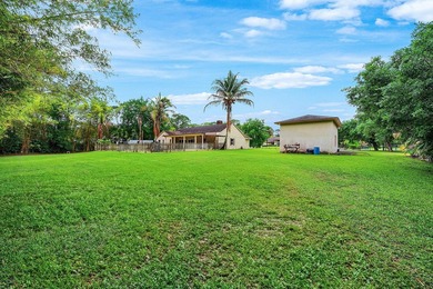 Set on a beautifully manicured and fenced 1.15-acre lot, this - photo 35