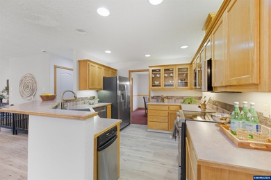 Newer roof, flooring, windows, furnace, heat pump, upper deck