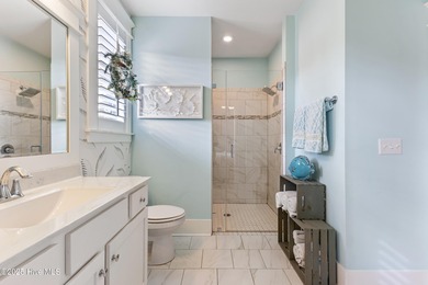 A showcase of refined coastal craftsmanship, this custom-built