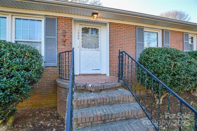 Full brick ranch home with large fenced-in backyard on a quiet