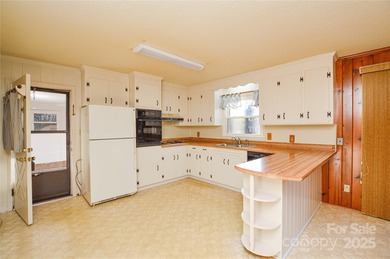 Full brick ranch home with large fenced-in backyard on a quiet