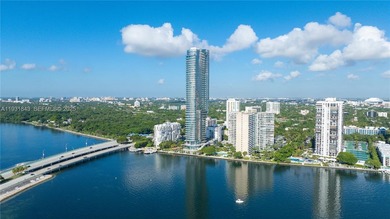 This brand-new 5-bedroom, 6.5-bath bayfront residence at UNA