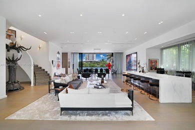 Private island living at its finest. This tropical modern estate