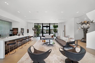 Private island living at its finest. This tropical modern estate