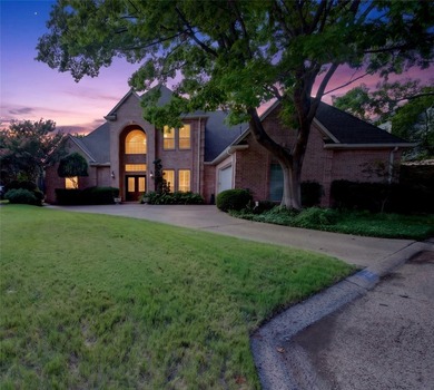 Nestled beneath mature shade trees in the prestigious gated - photo 2