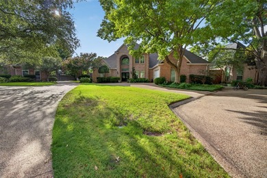 Nestled beneath mature shade trees in the prestigious gated - photo 3