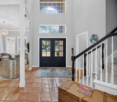 Nestled beneath mature shade trees in the prestigious gated - photo 4