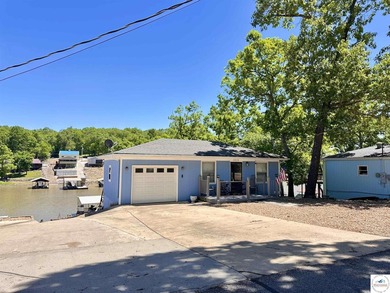 Located on a quiet cove on the Lake of the Ozarks in a very - photo 30